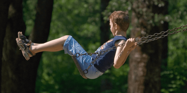 autistic teen on a swing shows empathy to other teens with autism